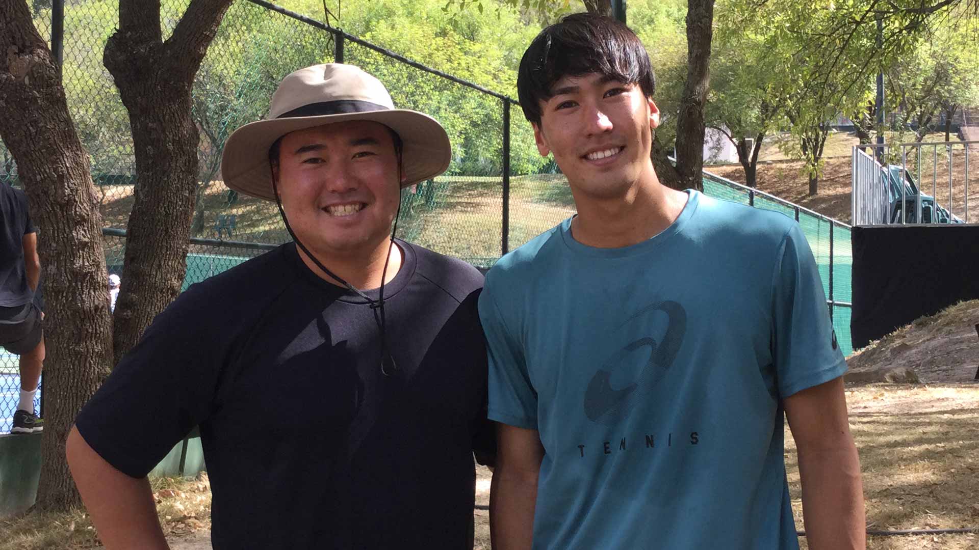 Yosuke Watanuki poses with coach and brother Keisuke.