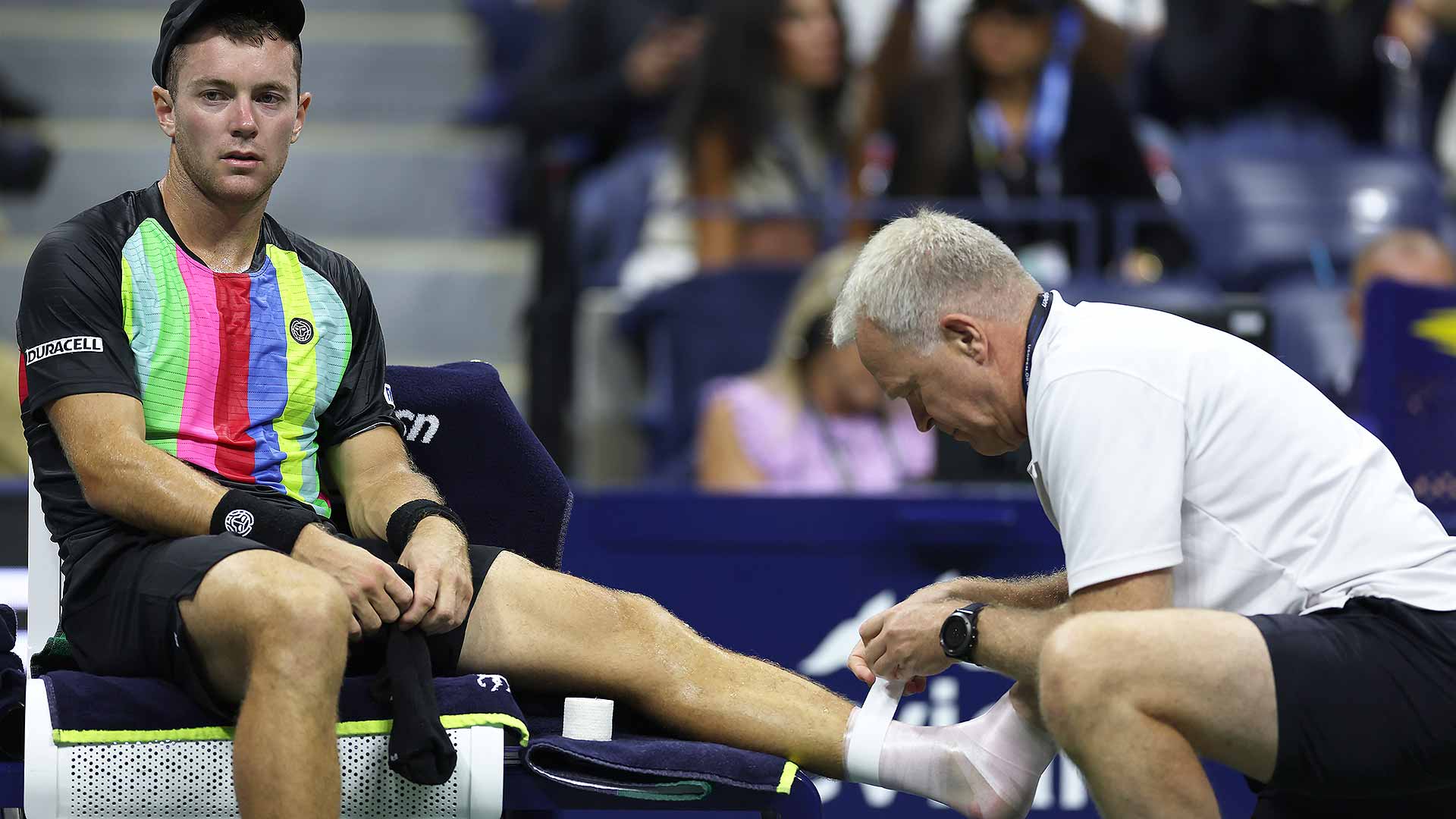 <a href='https://wwwx.atptour.com/en/players/dominik-koepfer/ke73/overview'>Dominik Koepfer</a> receives treatment in the first game from ATP physio Per Bastholt.