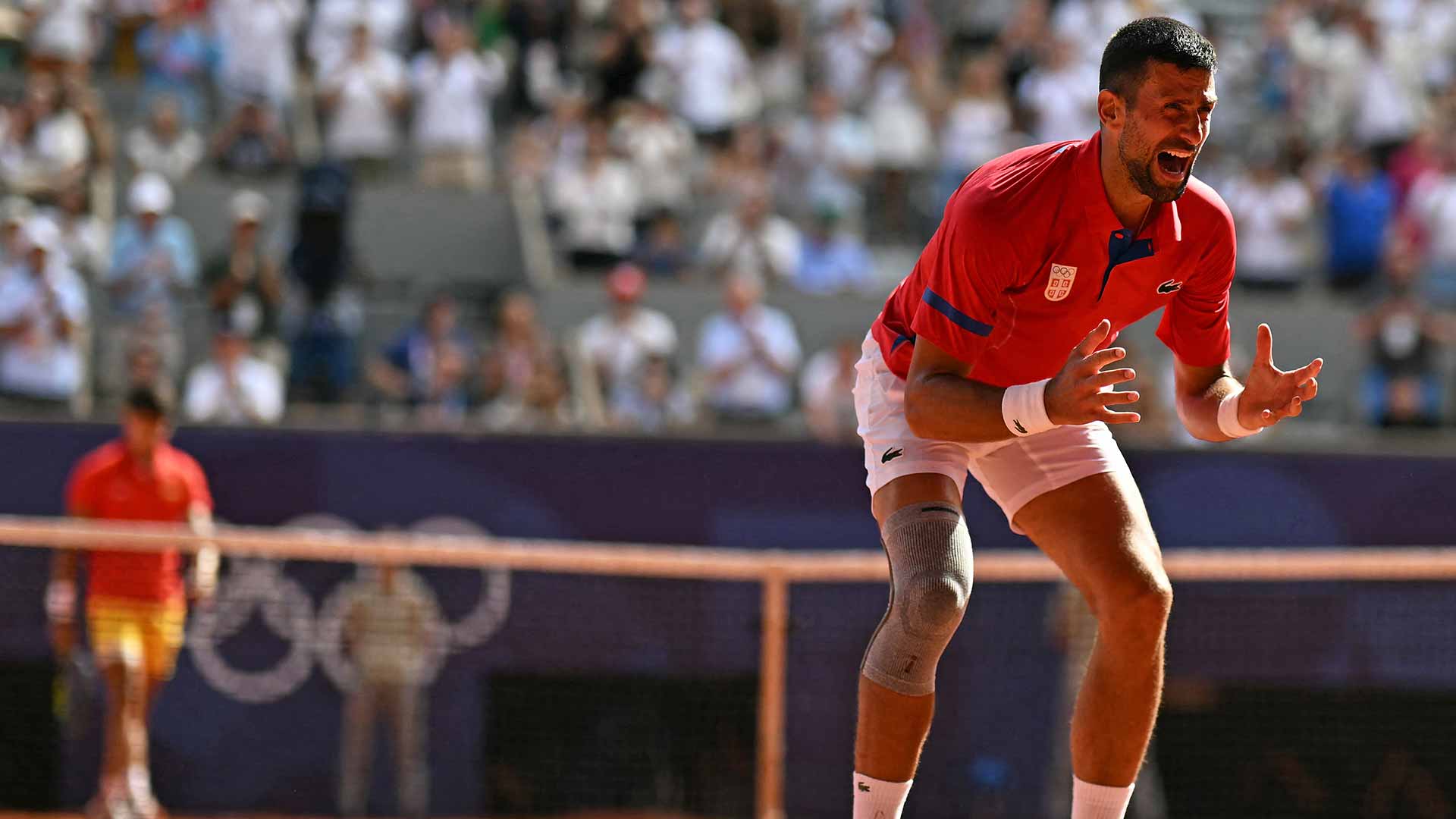 <a href='https://wwwx.atptour.com/en/players/novak-djokovic/d643/overview'>Novak Djokovic</a> celebrates the moment he clinches the gold medal at the <a href='https://wwwx.atptour.com/en/scores/archive/paris/96/2024/results'>Paris Olympics</a>.